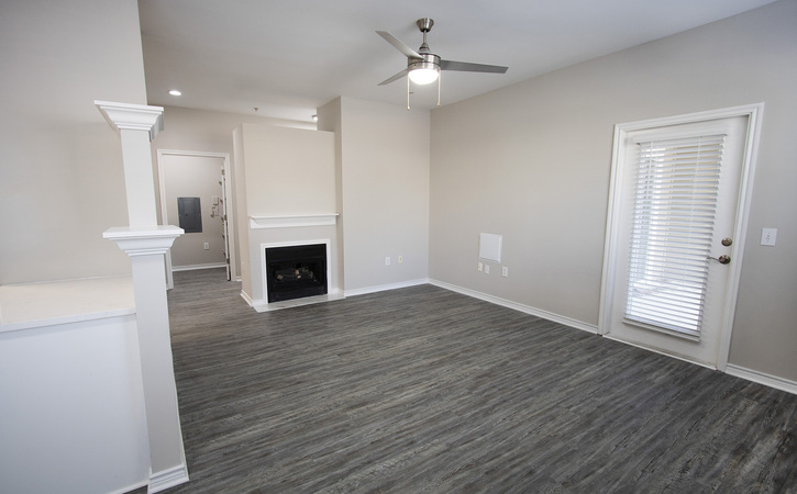 The Greens at Tryon Apartments Raleigh NC Platinum 1 Bedroom Floor Plan Living Room with Gas Log Fireplace Grey Laminate Flooring