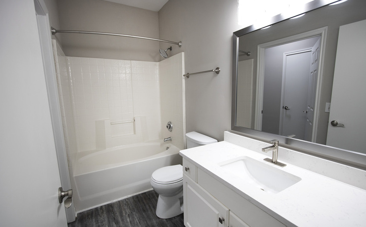 The Greens at Tryon Apartments Raleigh NC Platinum 1 Bedroom Floor Plan Upgraded Bathroom White Quartz Countertops Garden Bathtub Shower