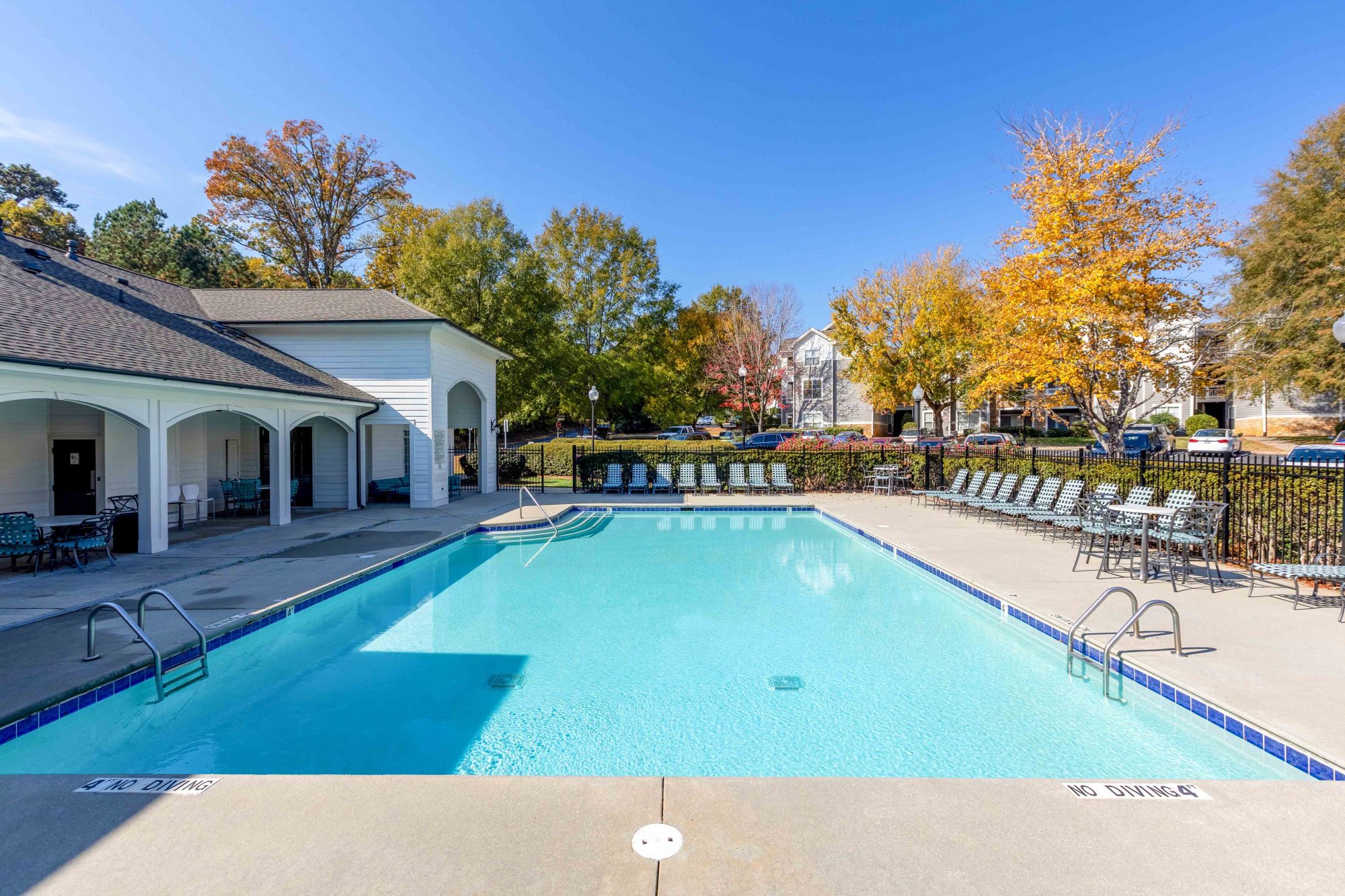 The Greens at Tryon Apartments in Raleigh NC Sparkling Swimming Pool and Clubhouse Exterior